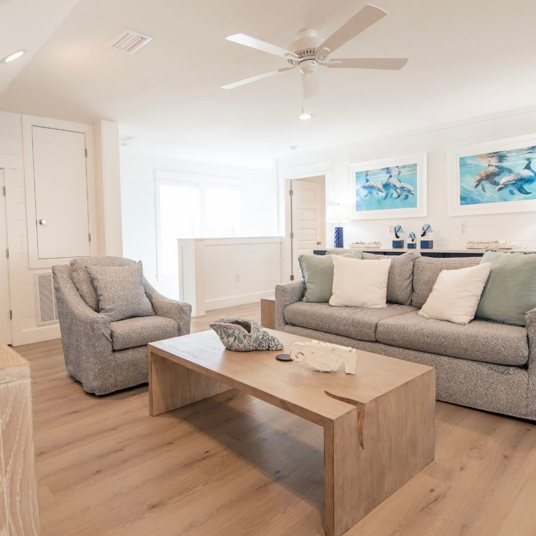 Living room with light wood-look plank flooring installed in the Elk Grove area