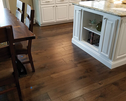 Kitchen and dining room with Monterey Gaucho hardwood floors by Sulca’s Carpets