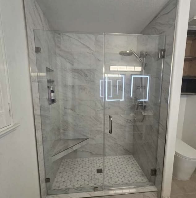 Walk-in glass shower with marble tile — bathroom remodel by Sulca's Carpets